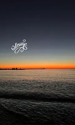 a view of the ocean at sunset with the word surfing at Apartment Hana in Bar