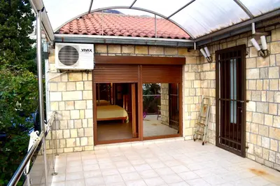an entry to a house with a glass door at Family Villa in Petrovac na Moru