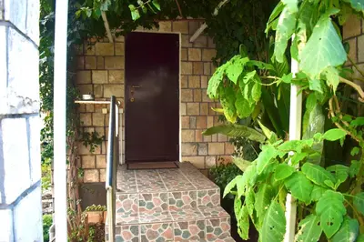 a door in a brick wall with a brick walkway at Family Villa in Petrovac na Moru