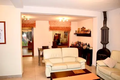 a living room with two white couches and a table at Family Villa in Petrovac na Moru
