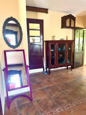 a mirror and a cabinet in a room at KotorHostelito in Kotor