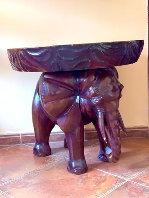 a statue of a bear with a table on its back at KotorHostelito in Kotor