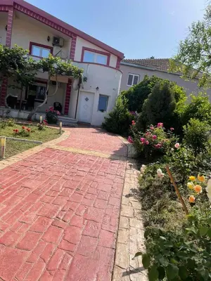 a brick walkway in front of a house at Villa Nilić in Bar