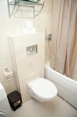 a bathroom with a toilet and a shower and a tub at Apartments LORA Cetinjska18 in Budva
