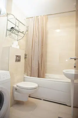 a bathroom with a toilet and a tub and a sink at Apartments LORA Cetinjska18 in Budva