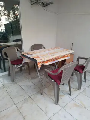a table and chairs sitting on a patio at Dominik in Bar