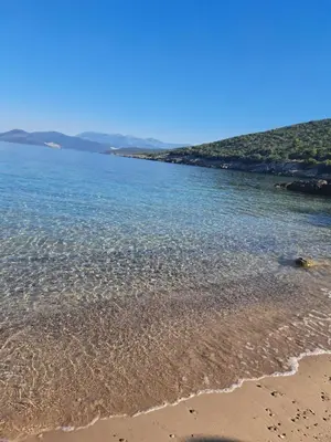 a beach with a body of water at Holiday Home Apartment Ceranic Kotor Tivat in Kotor