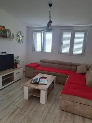 a living room with a couch and a coffee table at Holiday Home Apartment Ceranic Kotor Tivat in Kotor