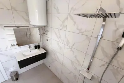 a bathroom with a sink and a mirror at Villa Olive Hill in Dobra Voda
