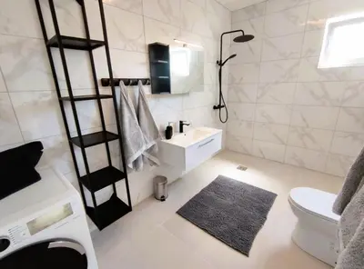a bathroom with a toilet and a sink at Villa Olive Hill in Dobra Voda