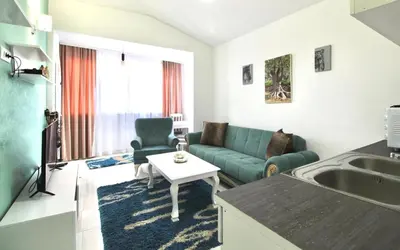 a living room with a couch and a table at Apartment ANA in Bar