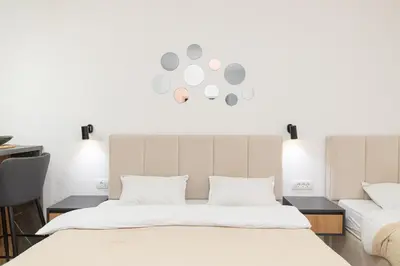 a bedroom with a large bed with white sheets at Villa Dana in Bar