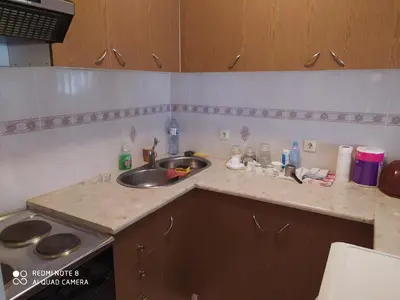 a kitchen with a sink and a counter top at Apartman Podkošljun in Budva