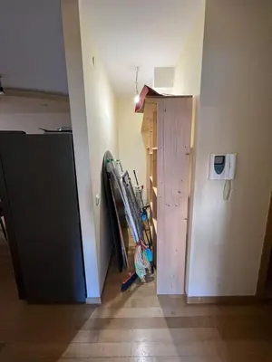 a room with a hallway with a door and a room with a closet at 'M&M' two bedroom apartment in center of Budva in Budva