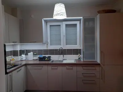 a kitchen with a sink and a window at Marija in Bar