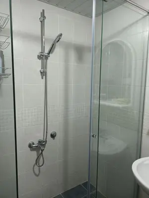 a shower with a glass door in a bathroom at Marija in Bar