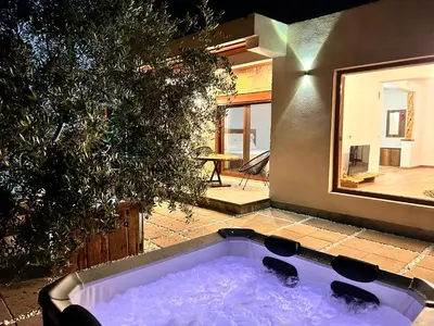 a jacuzzi tub in the backyard of a house at Greenscape Village in Ulcinj