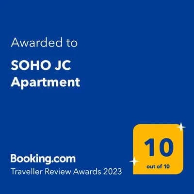 a yellow sign with the text awarded to solo ic appointment at SOHO JC Apartment in Bar