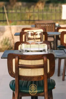 a table with two wine glasses on top of it at Carolea Villas - Boutique Hotel & Villas in Ulcinj