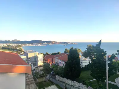 a view of the ocean from a building at Apartmani Durovic in Bar