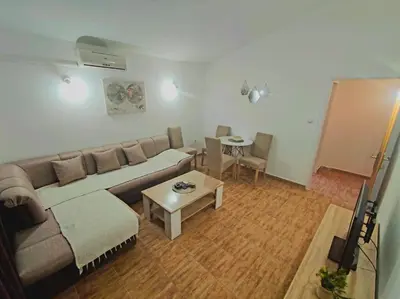 a living room with a couch and a table at Apartmani Durovic in Bar