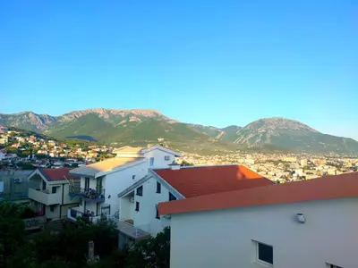 a view of a city with mountains in the background at Apartmani Durovic in Bar