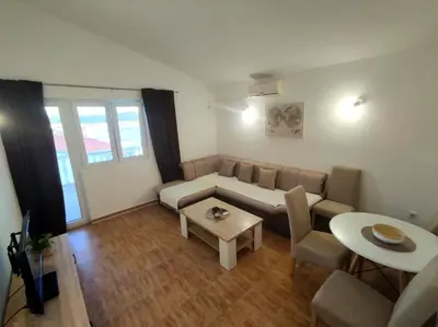 a living room with a couch and a table at Apartmani Durovic in Bar