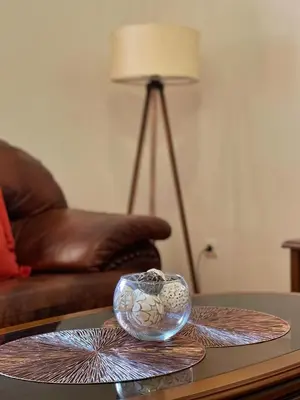 a glass bowl on top of a coffee table at Aquarium Apartment Kotor in Kotor