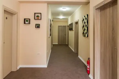 a hallway of a home with a hallway at Hotel Crnogorska Kuća in Podgorica