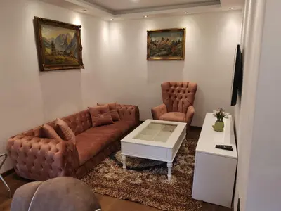 a living room with a couch and a coffee table at I&G APARTMENTS in Kotor