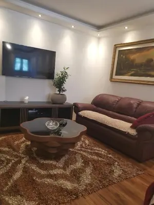 a living room with a couch and a table at I&G APARTMENTS in Kotor