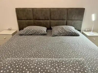a bedroom with a large bed with stars on it at Kaljevic 13 in Bar