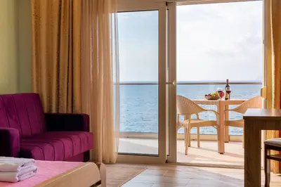a living room with a view of the ocean at DreamSea Apartment in Utjeha