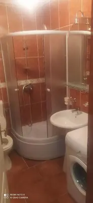 a bathroom with a shower and a toilet and a sink at Apartman Becici beach in Becici
