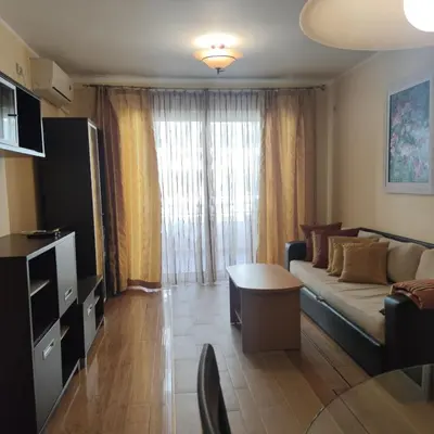 a living room with a couch and a table at Apartman Becici beach in Becici