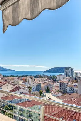 a view of the city from the balcony of a building at Baby Blue Apartments in Budva