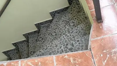 a bathroom floor with a black and gray pattern at Extra lokacija!!!!! in Sutomore