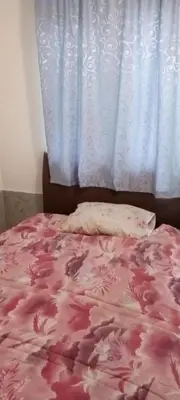 a bed with a pink blanket and a window at Extra lokacija!!!!! in Sutomore