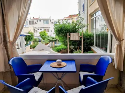 a room with a table and chairs and a window at Apartman - Fontana (Rafailovici) in Rafailovici