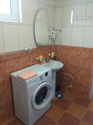 a washing machine in a bathroom with a sink at Studio Dina in Becici