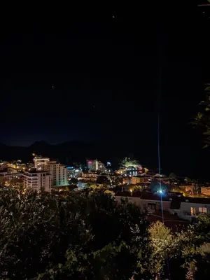 a view of a city at night at Apartman Lana in Petrovac na Moru
