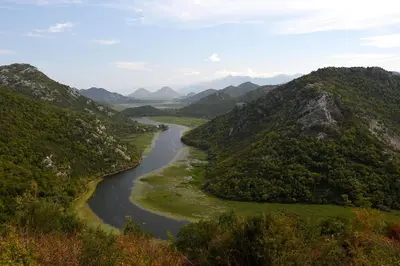 an aerial view of a river between two mountains at Holiday home in Rijeka Crnojevića