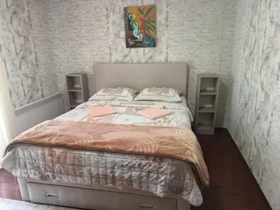 a bedroom with a bed with two pink envelopes on it at Holiday home in Rijeka Crnojevića