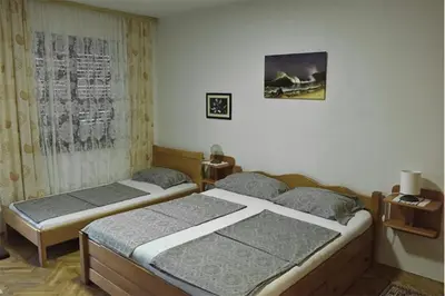 two twin beds in a bedroom with at Vila Mila in Petrovac na Moru