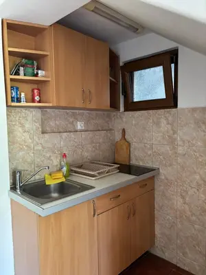 a kitchen with a sink and a counter top at Vila Mila in Petrovac na Moru