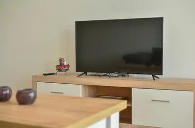 a flat screen tv sitting on top of a table at Sofija in Ulcinj