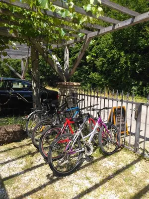 a group of bikes parked next to a fence at Lucha apartman in Rijeka Crnojevića