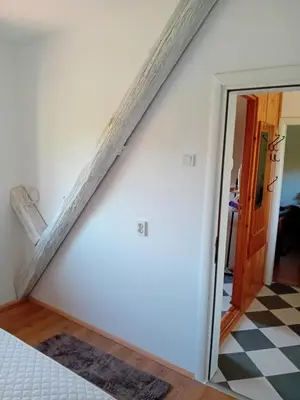 a staircase in a room with a mirror at Lucha apartman in Rijeka Crnojevića