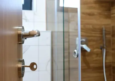 a bathroom with a shower with a glass door at MaNora in Ulcinj