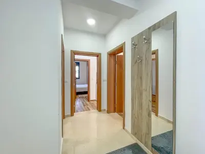 a hallway of a house with a mirror at MaNora in Ulcinj